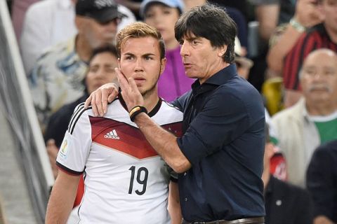 13.07.2014. Rio de Janeiro, Brazil. Mario Goetze (L) of Germany talks to head coach Joachim Loew of Germany as he goes on as a sub during the FIFA World Cup 2014 final soccer match between Germany and Argentina at the Estadio do Maracana in Rio de Janeiro, Brazil, 13 July 2014.