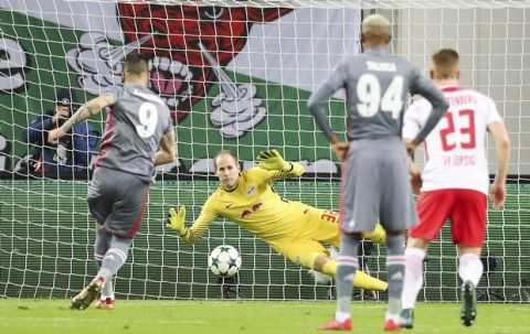 Istanbul's  Alvaro Negredo scores the opening goal from the penalty spot past Leipzig goalkeeper Peter Gulacsi during the Champions League group D soccer match between RB Leipzig and Besiktas Istanbul in Leipzig, eastern Germany, Wednesday, Dec. 6, 2017. (Jan Woitas/dpa via AP)