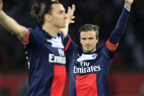 Paris Saint Germain's midfielder David Beckham from England, right, celebrates after Paris Saint Germain's forward Zlatan Ibrahimovic from Sweden, left, scores during their French League One soccer match against Brest, at the Parc des Princes stadium, in Paris, Saturday, May 18, 2013. Paris Saint-Germain hopes to strike a deal with David Beckham in the next two weeks in which the former England captain will work with the French club after retirement, possibly in an ambassadorial role. (AP Photo/Thibault Camus)