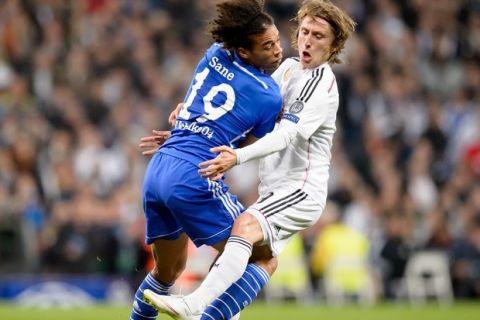 Schalke's forward Leroy Sane (L) vies with Real Madrid's Croatian midfielder Luka Modric during the round of 16 second leg UEFA Champions League football match Real Madrid CF vs FC Shalke 04 at the Santiago Bernabeu stadium in Madrid on March 10, 2015.  AFP PHOTO/ DANI POZO        (Photo credit should read DANI POZO/AFP/Getty Images)