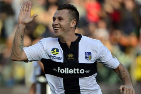 Parma FC 's french forward Antonio Cassano celebrates after scoring during the Italian Serie A football match Parma vs AC Milan, on October 27, 2013 at the Ennio Tardini stadium in Parma. AFP PHOTO / OLIVIER MORIN        (Photo credit should read OLIVIER MORIN/AFP/Getty Images)
