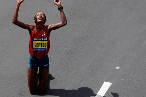 Apr 21, 2014; Boston, MA, USA; Rita Jeptoo (KEN) reacts after winning the women's division of the 2014 Boston Marathon. Mandatory Credit: Greg M. Cooper-USA TODAY Sports