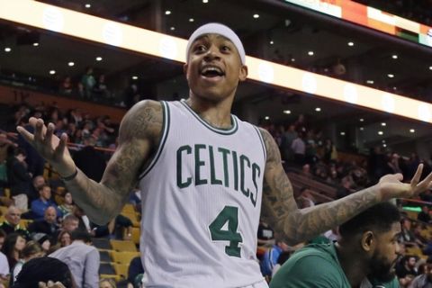 Boston Celtics guard Isaiah Thomas (4) gestures from the bench to a fan in the fourth quarter of an NBA basketball game against the Milwaukee Bucks, Thursday, Feb. 25, 2016, in Boston. (AP Photo/Elise Amendola)