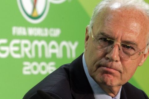 FILE - In this June 29, 2006 file photo Franz Beckenbauer, then President of the German Organization Committee of the soccer World Cup briefs the media during a news conference at the Olympic Stadium in Berlin. Swiss federal prosecutors say they are conducting an "ongoing operation" in an investigation of the 2006 World Cup organizing committee as part of a wider probe of corruption linked to FIFA. (AP Photo/Markus Schreiber, file )