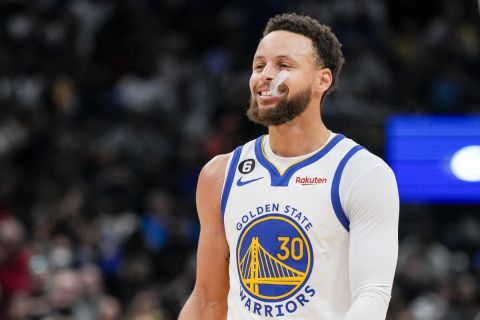 Golden State Warriors guard Stephen Curry (30) smiles during the second half of an NBA basketball game against the Washington Wizards, Monday, Jan. 16, 2023, in Washington. The Warriors won 127-118. (AP Photo/Jess Rapfogel)