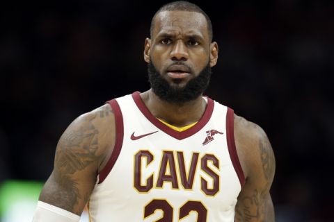Cleveland Cavaliers' LeBron James leaves the court after being ejected for a double technical in the second half of an NBA basketball game against the Miami Heat, Tuesday, Nov. 28, 2017, in Cleveland. The Cavaliers won 108-97. (AP Photo/Tony Dejak)