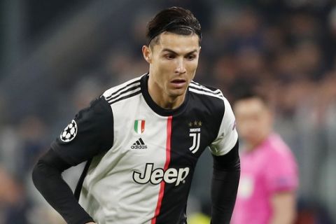 Juventus' Cristiano Ronaldo controls the ball during the Champions League group D soccer match between Juventus and Atletico Madrid at the Allianz stadium in Turin, Italy, Tuesday, Nov. 26, 2019. (AP Photo/Antonio Calanni)