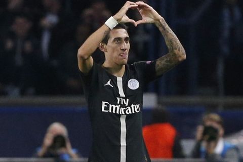 PSG forward Angel Di Maria, right, celebrates after scoring his side's second goal during a Group C Champions League soccer match between Paris Saint Germain and Napoli at the Parc des Princes stadium in Paris, Wednesday Oct. 24, 2018. (AP Photo/Thibault Camus)