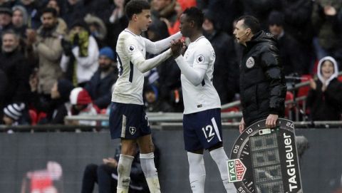 Tottenham's Victor Wanyama, right, is substituted on for Tottenham's Dele Ali during the English Premier League soccer match between Tottenham Hotspur and Arsenal at Wembley Stadium, London, Saturday, Feb. 10, 2018. (AP Photo/Tim Ireland)