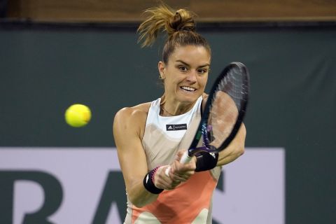 Maria Sakkari, of Greece, returns a shot to Shelby Rogers at the BNP Paribas Open tennis tournament Friday, March 10, 2023, in Indian Wells, Calif. (AP Photo/Mark J. Terrill)
