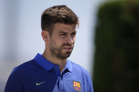 FC Barcelona's Gerard Pique arrives for a press conference at the Sports Center FC Barcelona Joan Gamper in Sant Joan Despi, Spain, Friday, May 26, 2017. FC Barcelona will play against Alaves in the Spanish Copa del Rey soccer final on Saturday. (AP Photo/Manu Fernandez)