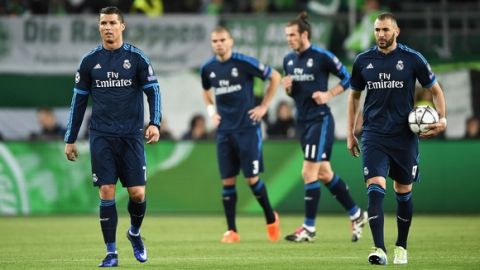 "WOLFSBURG, GERMANY - APRIL 06:  Cristiano Ronaldo (L) and Karim Benzema (R) of Real Madrid  show their dejeciton after Wolfsburg's second goal during the UEFA Champions League Quarter Final First Leg match between VfL Wolfsburg and Real Madrid at Volkswagen Arena on April 6, 2016 in Wolfsburg, Germany.  (Photo by Stuart Franklin/Bongarts/Getty Images)"