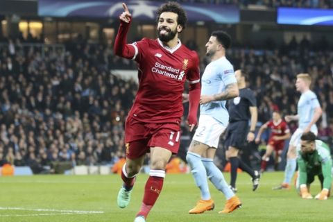 Liverpool's Mohamed Salah celebrates scoring his side's first goal of the game during the  Champions League, quarterfinal second leg soccer match against Manchester City at the Etihad Stadium, Manchester, England Tuesday April 10, 2018. (Nick Potts/PA via AP)