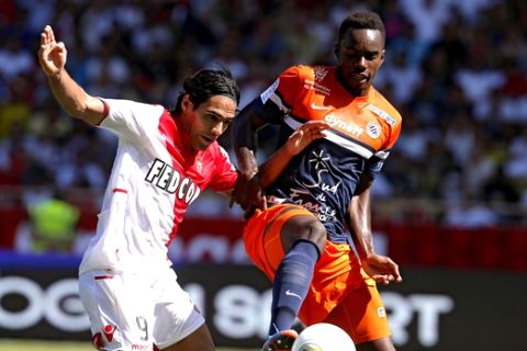 Monaco's Radamel Falcao of Colombia, left, challenges for the ball with Montpellier's Teddy Mezague of France during their French League One soccer match, Sunday, Aug. 18, 2013, in Monaco stadium. (AP Photo/Lionel Cironneau)