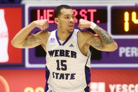 Weber State's Davion Berry celebrates after scoring against North Dakota during the second half of an NCAA college basketball game in the championship of the Big Sky Conference tournament Saturday, March 15, 2014, in Ogden, Utah. Weber State won 88-67. (AP Photo/Rick Bowmer)