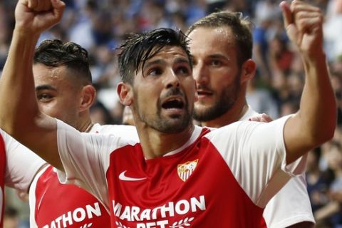Sevilla's Nolito celebrates with team mates after scoring his side's second goal during the Spanish La Liga soccer match between Espanyol and Sevilla at the RCDE Stadium in Barcelona, Spain, Sunday Aug.18, 2019. (AP Photo/Joan Monfort)
