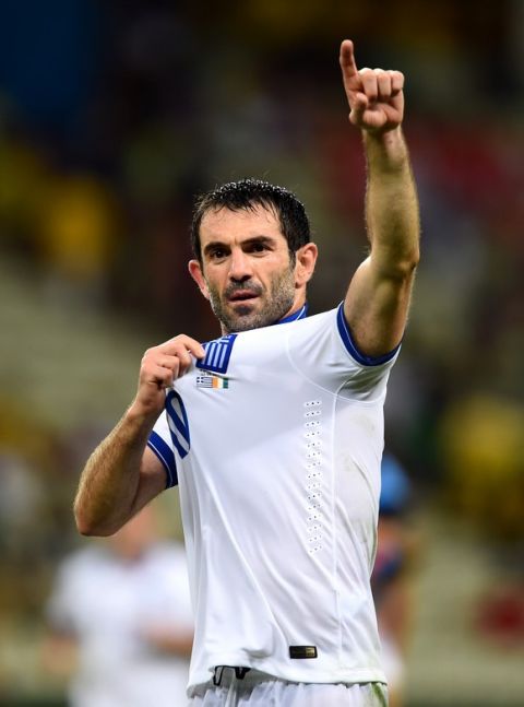 FORTALEZA, BRAZIL - JUNE 24:  Giorgos Karagounis of Greece celebrates after defeating the Ivory Coast 2-1 during the 2014 FIFA World Cup Brazil Group C match between Greece and the Ivory Coast at Castelao on June 24, 2014 in Fortaleza, Brazil.  (Photo by Jamie McDonald/Getty Images)