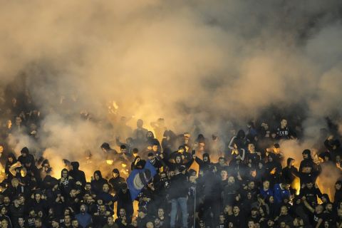 Dinamo's funs hold flairs and chant slogans during the Champions League group E soccer match between Dinamo Zagreb and Salzburg at the Maksimir stadium, in Zagreb, Croatia, Tuesday, Oct. 11, 2022. (AP Photo/Darko Bandic)