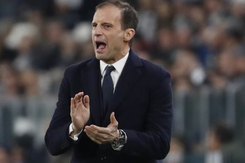 FILE - In this Nov. 27, 2018 file photo, Juventus coach Massimiliano Allegri gestures during the Champions League group H soccer match between Juventus and Valencia at the Allianz stadium in Turin, Italy. Inter Milan is heading to Juventus determined to prove the battle for the Serie A title is not already over. Inter is third but already 11 points behind Juventus and anything but a win Friday, Dec. 7, 2018, against the Serie A leader in Turin will surely rule the Nerazzurri out of the title race. (AP Photo/Antonio Calanni, file)