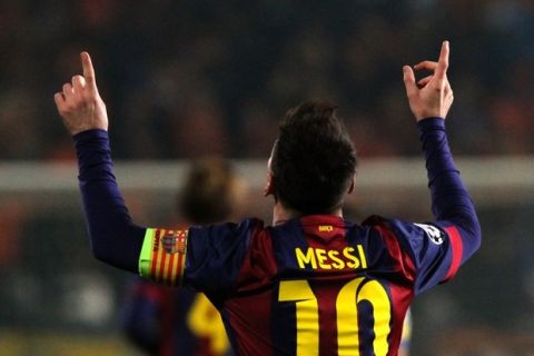 Barcelona's Argentinian forward Lionel Messi celebrates after scoring his second goal during their UEFA Champions League football match against Apoel at the Neo GSP Stadium in the Cypriot capital, Nicosia, on November 25, 2014.  AFP PHOTO / YIANNIS KOURTOGLOU        (Photo credit should read Yiannis Kourtoglou/AFP/Getty Images)