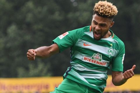 FILE - In this Oct. 1, 2016 file picture Bremen's Serge Gnabry celebrates his 2-1 goal during the German Bundesliga fsoccer match between Darmstadt 98 and Werder Bremen  in Darmstadt, Germany. Germany coach Joachim Loew has called up three players from the under-21 side Friday Nov. 4, 2016  for upcoming World Cup qualifier against San Marino and the friendly against Italy The newcomers are defenders Benjamin Henrichs of Bayer Leverkusen, Yannick Gerhard of Wolfsburg, Serge Gnabry of Werder Bremen.  (Boris Roessler/dpa via AP)