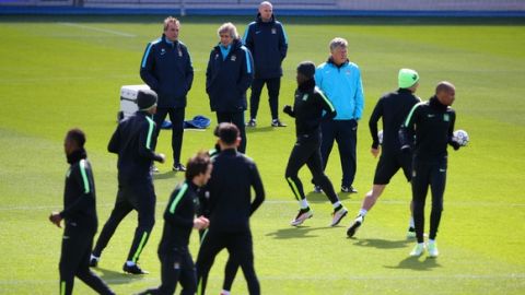 "MANCHESTER, ENGLAND - APRIL 25:  Manuel Pellegrini manager of Manchester City watches players warm up during a Manchester City training session on the eve of their UEFA Champions League semi final first leg match against Real Madrid at the Academy training ground on April 25, 2016 in Manchester, United Kingdom.  (Photo by Dave Thompson/Getty Images)"