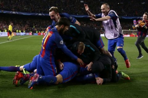 Barcelona players celebrate their victory at the end of the Champion League round of 16, second leg soccer match against Paris Saint Germain at the Camp Nou stadium in Barcelona, Spain, Wednesday March 8, 2017. (AP Photo/Emilio Morenatti)