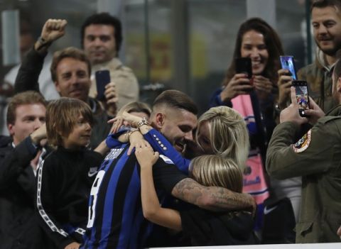 Inter Milan's Mauro Icardi, center, celebrates after scoring during the Serie A soccer match between Inter Milan and AC Milan at the San Siro Stadium, in Milan, Italy, Sunday, Oct. 21, 2018. (AP Photo/Antonio Calanni)