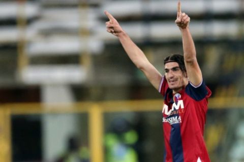 Bologna's Lazaros Christodoulopoulos, of Greece, celebrates after scoring the winning goal during an Italian Serie A soccer match between Bologna and Fiorentina at Renato Dall' Ara stadium in Bologna, Italy, Tuesday, Feb. 26, 2013. (AP Photo/Gianfilippo Oggioni) 