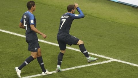 France's Antoine Griezmann, right, celebrates after scoring his side's second goal during the final match between France and Croatia at the 2018 soccer World Cup in the Luzhniki Stadium in Moscow, Russia, Sunday, July 15, 2018. (AP Photo/Thanassis Stavrakis)