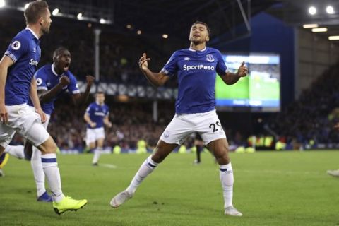 Everton's Dominic Calvert-Lewin celebrates scoring his side's first goal of the game against Crystal Palace, during their English Premier League soccer match at Goodison Park in Liverpool, England, Sunday, Oct. 21, 2018. (Tim Goode/PA via AP)