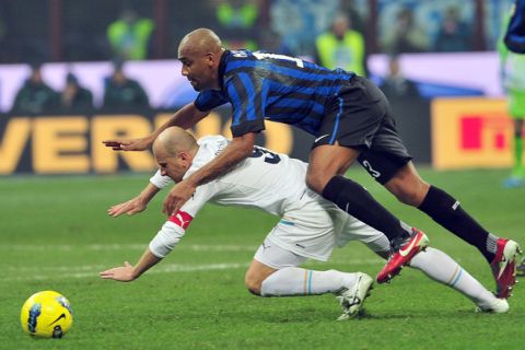Inter Milan's Brazilian defender Maicon (top) vies with Lazio's forward Tommaso Rocchi during their Italian Serie A football match between Inter Milan and Lazio at the San Siro Stadium in Milan on January 22, 2012.  AFP PHOTO / GIUSEPPE CACACE (Photo credit should read GIUSEPPE CACACE/AFP/Getty Images)