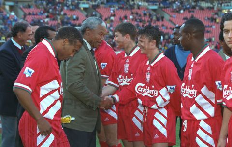 JOHANNESBURG, REPUBLIC OF SOUTH AFRICA - Sunday, May 29, 1994: Life-long Liverpool FC supporter and newly elected President of the Republic of South Africa Nelson Mandela meets the Liverpool players before the United Bank Soccer Festival friendly match at Ellis Park Stadium. John Barnes and Lee Jones (Pic by David Rawcliffe/Propaganda)