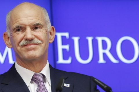 Greece's Prime Minister George Papandreou talks to media during a news conference at the end of an euro zone leaders crisis summit in Brussels July 21, 2011. REUTERS/Thierry Roge (BELGIUM - Tags: POLITICS BUSINESS)