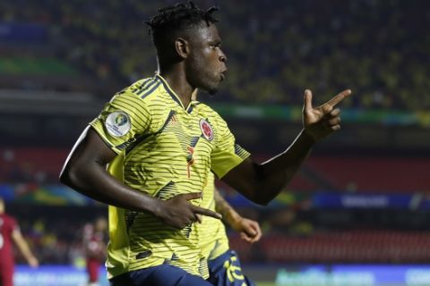 Colombia's Duvan Zapata celebrates after scoring against Qatar during a Copa America Group B soccer match at the Morumbi stadium in Sao Paulo, Brazil, Wednesday, June 19, 2019. (AP Photo/Victor R. Caivano)