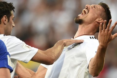 Germany's Sandro Wagner, right, celebrates his goal at 2:0 with Lars Stindl during the World Cup qualifier Group C soccer match between Germany and San Marino at the Stadion Nuernberg in Nuremberg, Germany, Saturday June 10, 2017. (Andreas Gebert/dpa via AP)