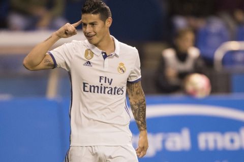 Real Madrid's James Rodriguez reacts after scoring a goal during a Spanish La Liga soccer match between Deportivo La Coruna and Real Madrid at the Riazor stadium in A Coruna, Spain, Wednesday April 26, 2017. (AP Photo/Lalo R. Villar)