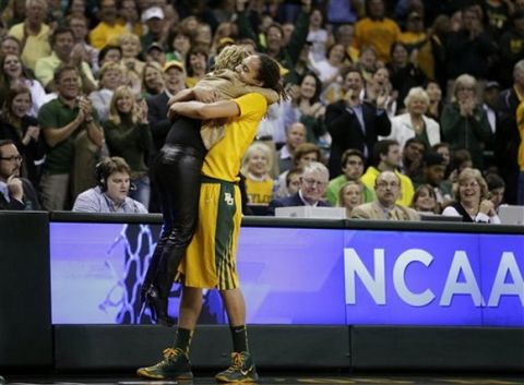 Baylor head coach Kim Mulkey, left, is lifted off her feet by Brittney Griner as Griner leaves the court in the second half of a second-round game in the women's NCAA college basketball tournament against Florida State, Tuesday, March 26, 2013, in Waco, Texas. Baylor won 85-47. (AP Photo/Tony Gutierrez)