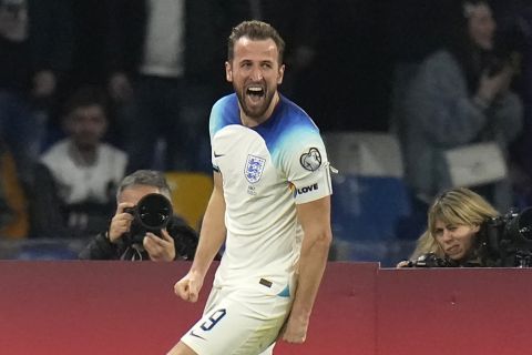 England's Harry Kane celebrates after scoring his side's second goal during the Euro 2024 group C qualifying soccer match between Italy and England at the Diego Armando Maradona stadium in Naples, Italy, Thursday, March 23, 2023. (AP Photo/Alessandra Tarantino)