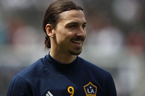 Los Angeles Galaxy's Zlatan Ibrahimovic, of Sweden, smiles during warmups for the team's MLS soccer match against the Los Angeles FC Saturday, March 31, 2018, in Carson, Calif. (AP Photo/Jae C. Hong)