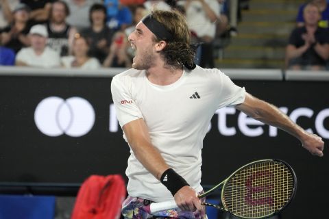 Stefanos Tsitsipas of Greece celebrates after defeating Quentin Halys of France in their first round match at the Australian Open tennis championship in Melbourne, Australia, Monday, Jan. 16, 2023. (AP Photo/Dita Alangkara)