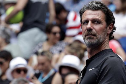 Serena Williams' coach Patrick Mouratoglou watches her first round match against Germany's Tatjana Maria at the Australian Open tennis championships in Melbourne, Australia, Tuesday, Jan. 15, 2019. (AP Photo/Kin Cheung)