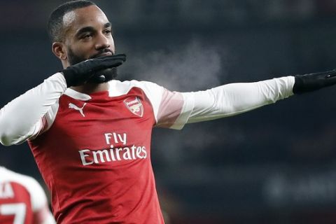 Arsenal's Alexandre Lacazette celebrates after scoring his side's first goal during the Europa League group E soccer match between Arsenal and Qarabag at Emirates stadium in London, England, Thursday, Dec. 13, 2018. (AP Photo/Frank Augstein)