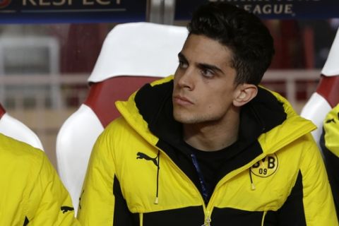 Dortmund's Marc Bartra sits on the bench before the Champions League quarterfinal second leg soccer match between Monaco and Dortmund at the Louis II stadium in Monaco, Wednesday April 19, 2017. (AP Photo/Claude Paris)