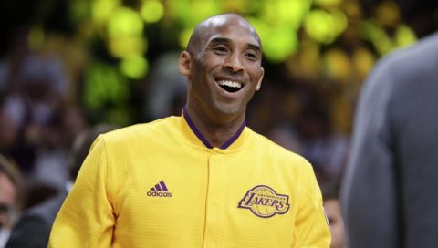 Los Angeles Lakers forward Kobe Bryant smiles to the crowd during a ceremony before Bryant's last NBA basketball game, against the Utah Jazz, Wednesday, April 13, 2016, in Los Angeles. (AP Photo/Jae C. Hong)