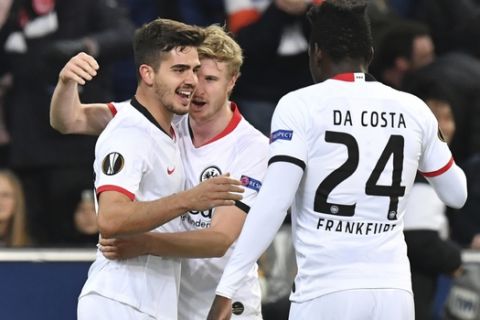 Frankfurt's Andre Silva, left, celebrates after scoring his side's second goal during the Europa League round of 32 second leg soccer match between FC Red Bull Salzburg and Eintracht Frankfurt at the Red Bull Arena in Salzburg, Austria, Friday, Feb. 28, 2020. (AP Photo/Kerstin Joensson)