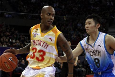 Stephon Marbury of China North team drives the ball down the court against Liu Wei of China South team, during the China Basketball Association's all star game, Beijing, China, Sunday, March 21, 2010. (AP Photo/ Gemunu Amarasinghe)