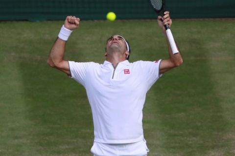 Switzerland's Roger Federer celebrates after beating Spain's Rafael Nadal in a Men's singles semifinal match on day eleven of the Wimbledon Tennis Championships in London, Friday, July 12, 2019. (Andy Couldridge/Pool Photo via AP)