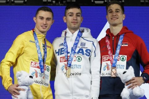 Silver medalist Thobias Nilsson Montler of Sweden, gold medalist Miltiadis Tentoglou of Greece and bronze medalist Strahinja Jovancevic of Serbia, from left to right, pose on the podium of the men's long jump final at the European Athletics Indoor Championships at the Emirates Arena in Glasgow, Scotland, Sunday, March 3, 2019. (AP Photo/Alastair Grant)