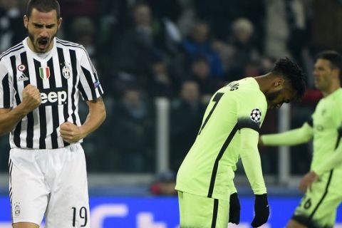 Juventus' defender from Italy Leonardo Bonucci (L) celebrates next to Manchester City's forward Raheem Sterling at the end of the UEFA Champions League football match Juventus vs Manchester City on November 25, 2015 at the Juventus Stadium in Turin. Juventus won 1- 0      AFP PHOTO / OLIVIER MORIN / AFP / OLIVIER MORIN        (Photo credit should read OLIVIER MORIN/AFP/Getty Images)